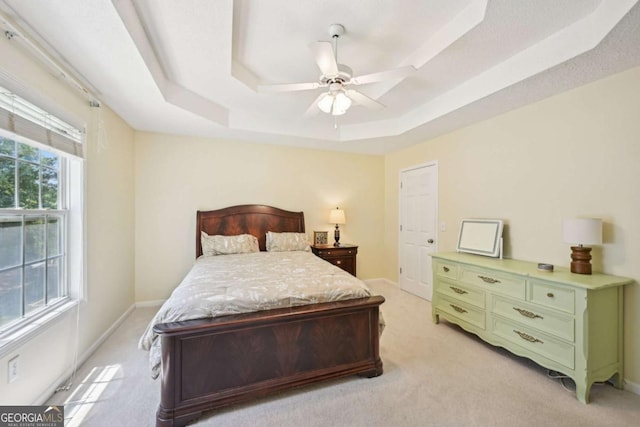 3705 Tate Pl, Austell, GA 30106 - bedroom with a raised ceiling, light colored carpet, and ceiling fan