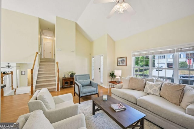 3705 Tate Pl, Austell, GA 30106 - living area featuring a ceiling fan, high vaulted ceiling, stairs, and wood finished floors