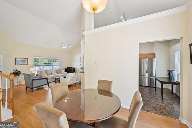 3705 Tate Pl, Austell, GA 30106 - dining area with light wood-style flooring, ceiling fan, and high vaulted ceiling