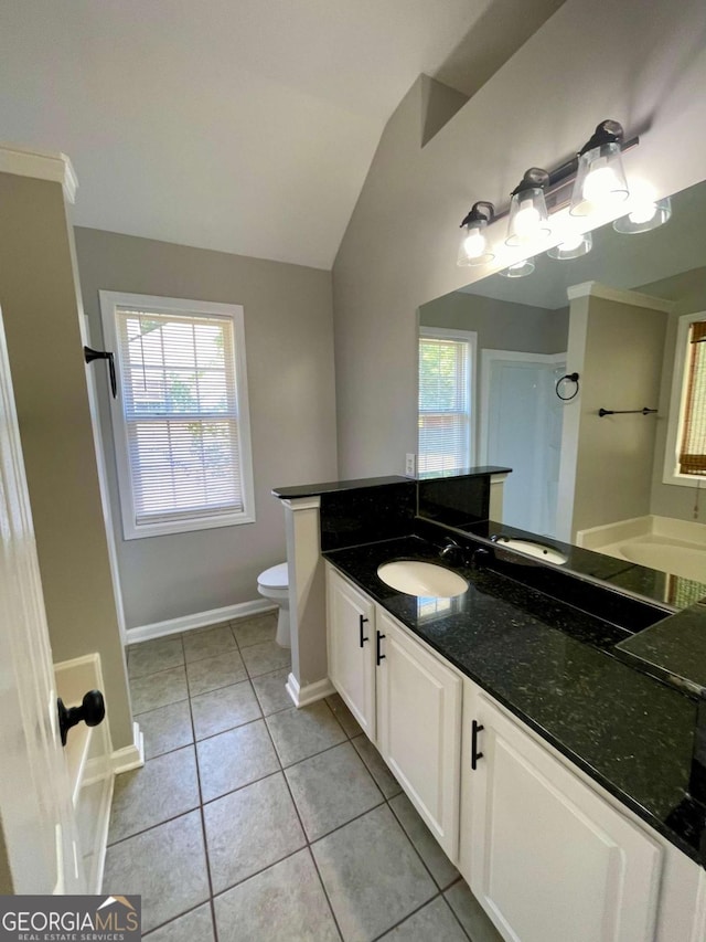 350 Fall View Ct, Winder, GA 30680 - full bathroom featuring vanity, plenty of natural light, tile patterned floors, and vaulted ceiling