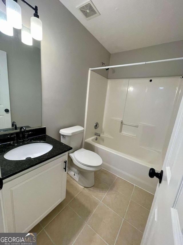 350 Fall View Ct, Winder, GA 30680 - bathroom featuring tile patterned floors, vanity, and tub / shower combination