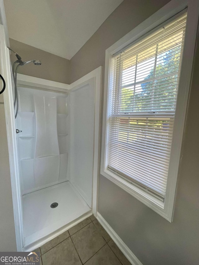 350 Fall View Ct, Winder, GA 30680 - bathroom with tile patterned floors and a shower