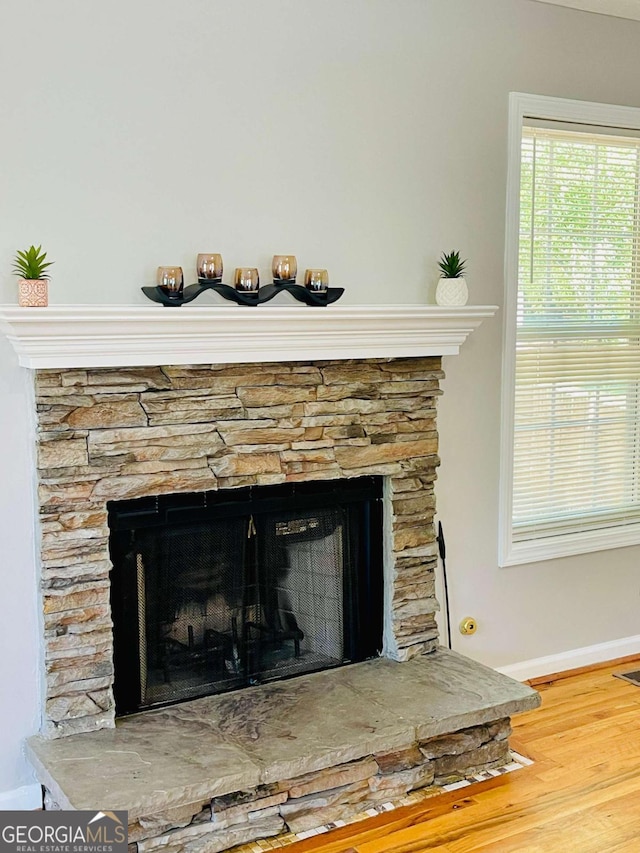 350 Fall View Ct, Winder, GA 30680 - detailed view of a stone fireplace and wood finished floors