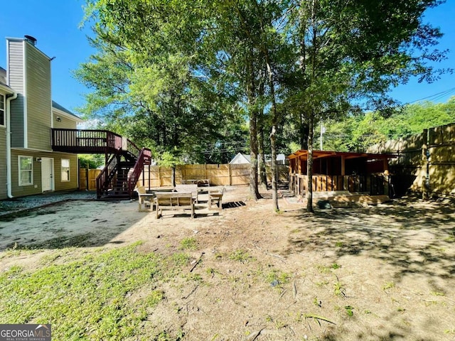 350 Fall View Ct, Winder, GA 30680 - view of yard featuring stairs, a wooden deck, and a patio area
