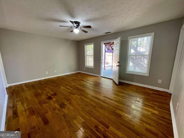 350 Fall View Ct, Winder, GA 30680 - unfurnished room with dark wood-style flooring, a ceiling fan, and a textured ceiling