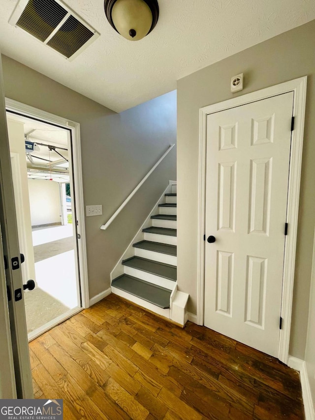 350 Fall View Ct, Winder, GA 30680 - stairway featuring hardwood / wood-style flooring and baseboards