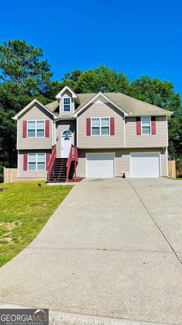 350 Fall View Ct, Winder, GA 30680 - raised ranch with a garage, concrete driveway, and a front lawn