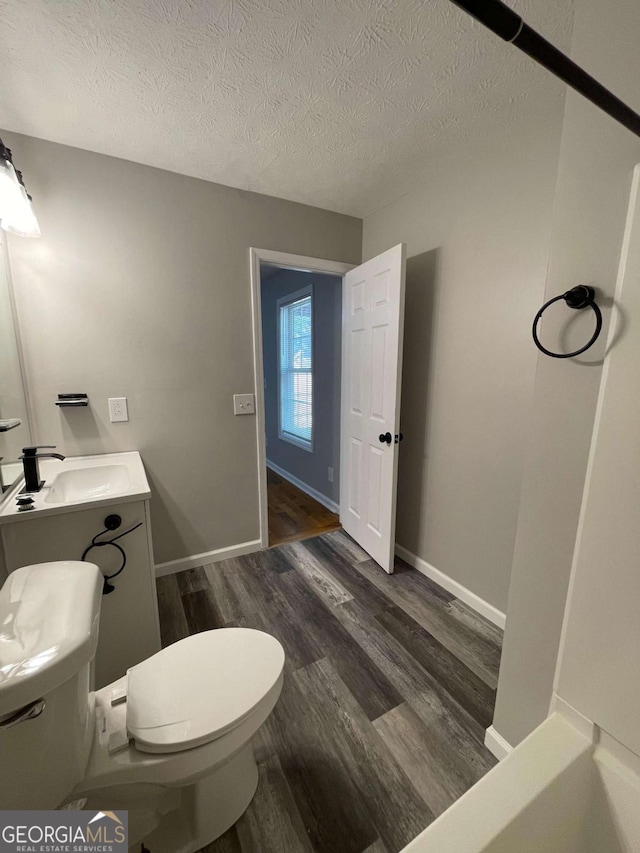 350 Fall View Ct, Winder, GA 30680 - bathroom with wood finished floors, a textured ceiling, and vanity
