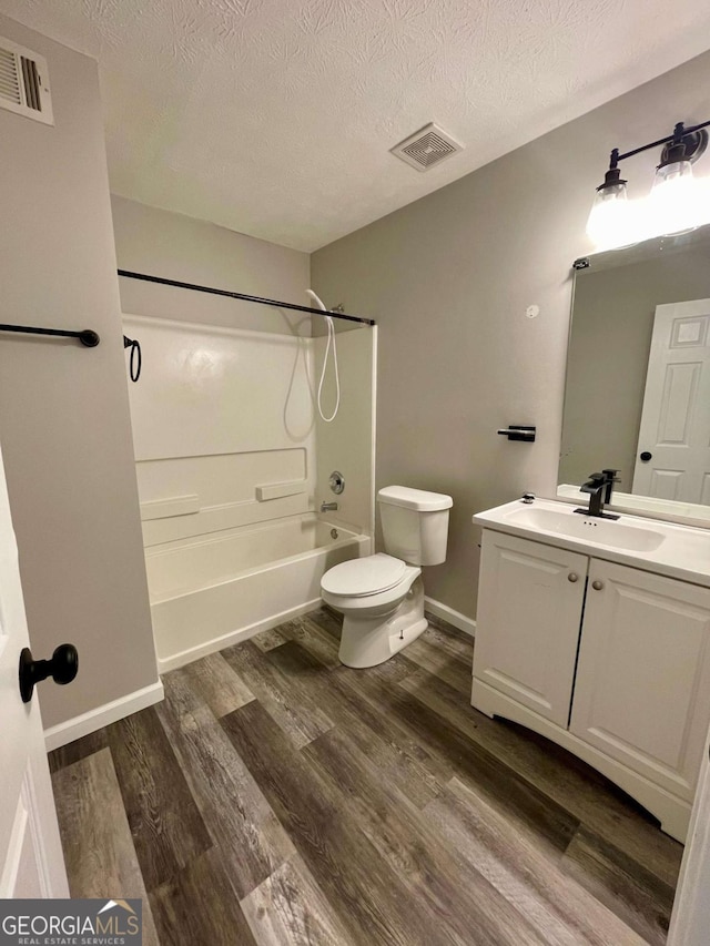 350 Fall View Ct, Winder, GA 30680 - full bath featuring shower / washtub combination, vanity, wood finished floors, and a textured ceiling