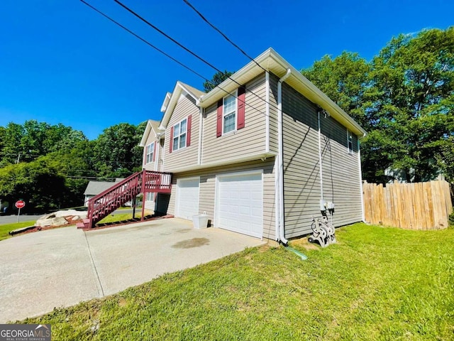 350 Fall View Ct, Winder, GA 30680 - view of home's exterior featuring an attached garage, concrete driveway, and stairway