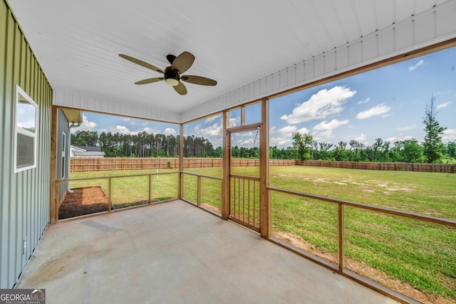 1354 Lakeway Rd, East Dublin, GA 31027 - unfurnished sunroom featuring a ceiling fan and view of wooded area