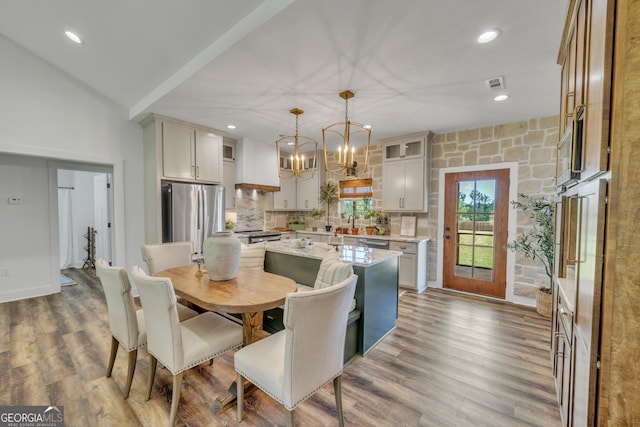 1354 Lakeway Rd, East Dublin, GA 31027 - dining space with wood finished floors, a chandelier, and recessed lighting