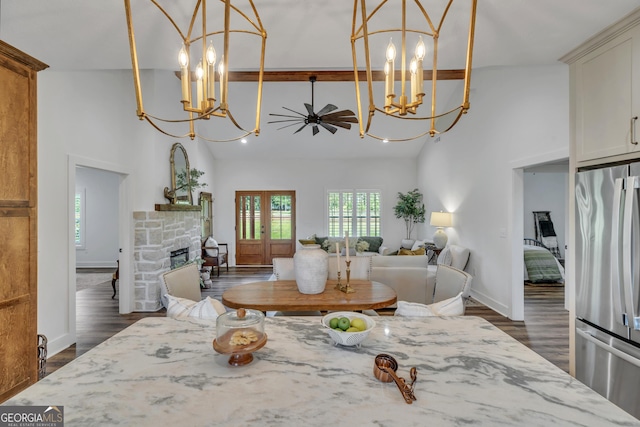 1354 Lakeway Rd, East Dublin, GA 31027 - dining area featuring a chandelier, healthy amount of natural light, high vaulted ceiling, and a fireplace