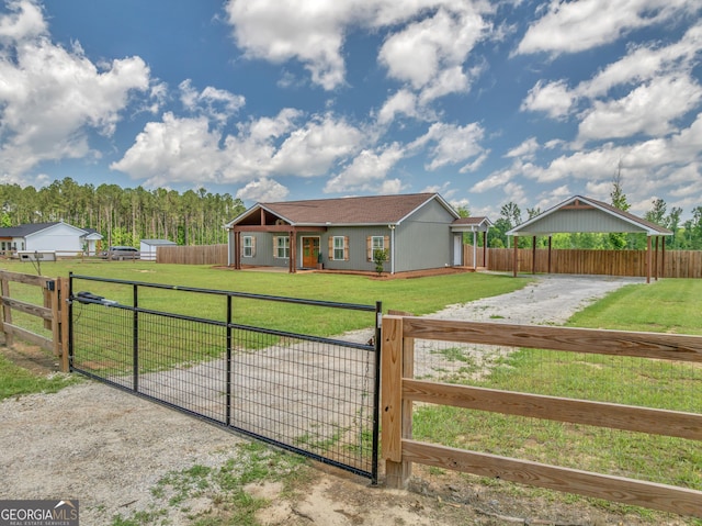 1354 Lakeway Rd, East Dublin, GA 31027 - ranch-style house with a gate, gravel driveway, and a carport