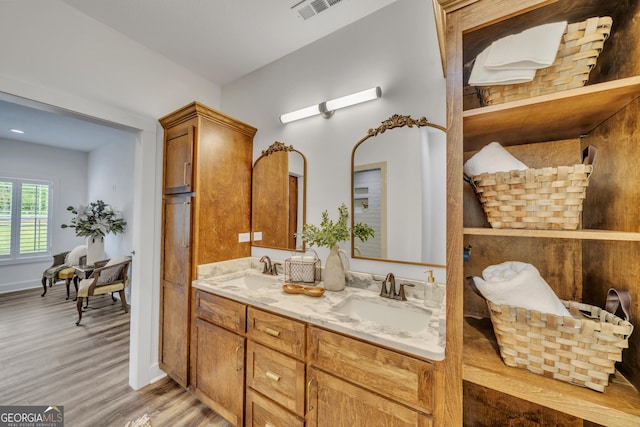 1354 Lakeway Rd, East Dublin, GA 31027 - full bathroom featuring wood finished floors and double vanity