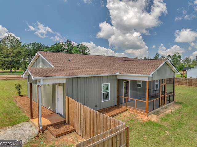 1354 Lakeway Rd, East Dublin, GA 31027 - back of house featuring a shingled roof and a sunroom
