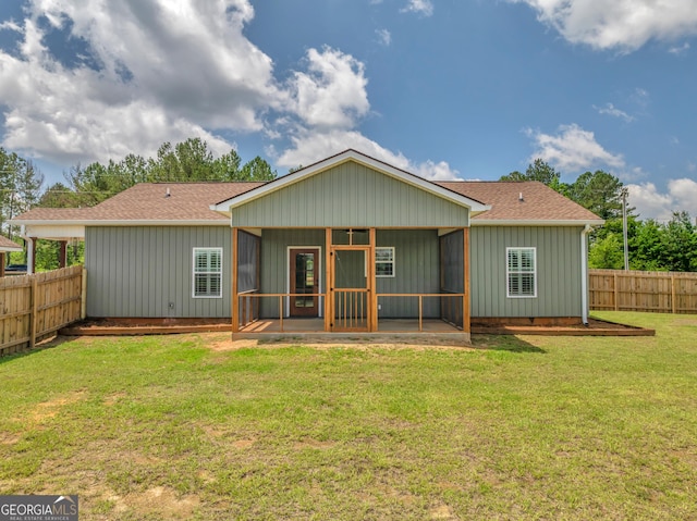 1354 Lakeway Rd, East Dublin, GA 31027 - back of property featuring a sunroom, a shingled roof, and board and batten siding