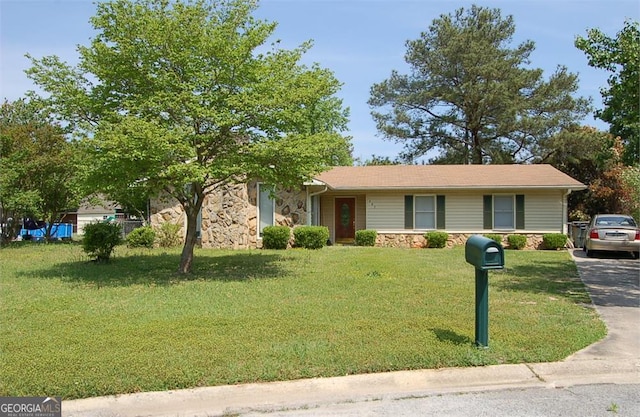 405 Tumbleweed Cir, Centerville, GA 31028 - view of front of home featuring stone siding and a front lawn