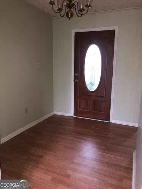 405 Tumbleweed Cir, Centerville, GA 31028 - foyer featuring a chandelier, wood finished floors, and baseboards