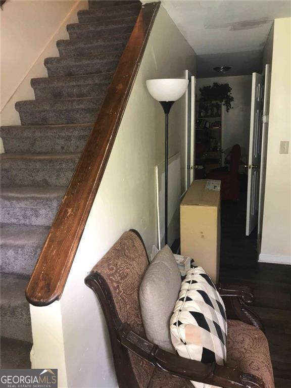 3503 Ten Oaks Ct, Powder Springs, GA 30127 - staircase with wood finished floors and baseboards
