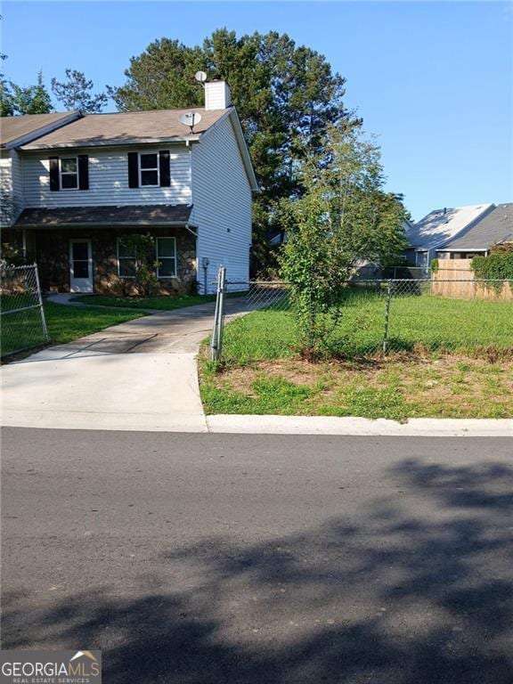 3503 Ten Oaks Ct, Powder Springs, GA 30127 - view of front of house with a chimney and driveway