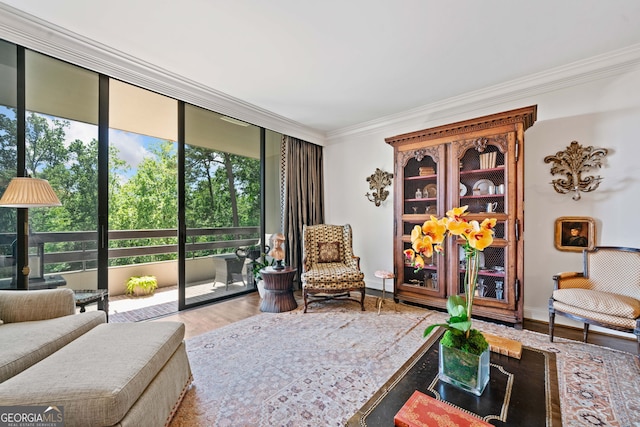 2660 Peachtree Rd Unit 6A, Atlanta, GA 30305 - living area featuring healthy amount of natural light, crown molding, a wall of windows, and wood finished floors