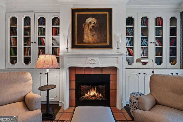2660 Peachtree Rd Unit 6A, Atlanta, GA 30305 - tiled living area featuring crown molding and a tile fireplace