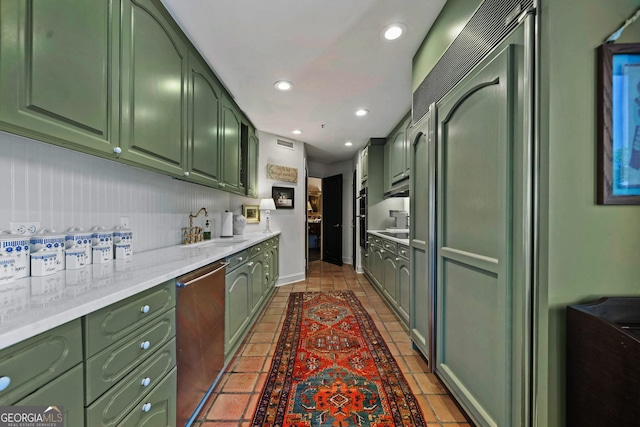 2660 Peachtree Rd Unit 6A, Atlanta, GA 30305 - kitchen featuring green cabinets, stainless steel dishwasher, recessed lighting, and tile patterned flooring