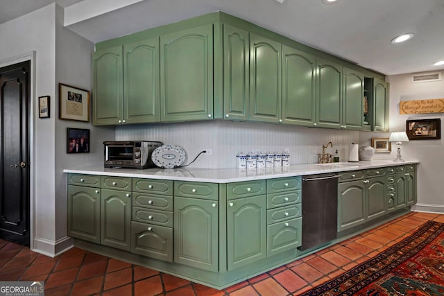 2660 Peachtree Rd Unit 6A, Atlanta, GA 30305 - kitchen featuring green cabinets, light countertops, dark tile patterned floors, recessed lighting, and stainless steel dishwasher