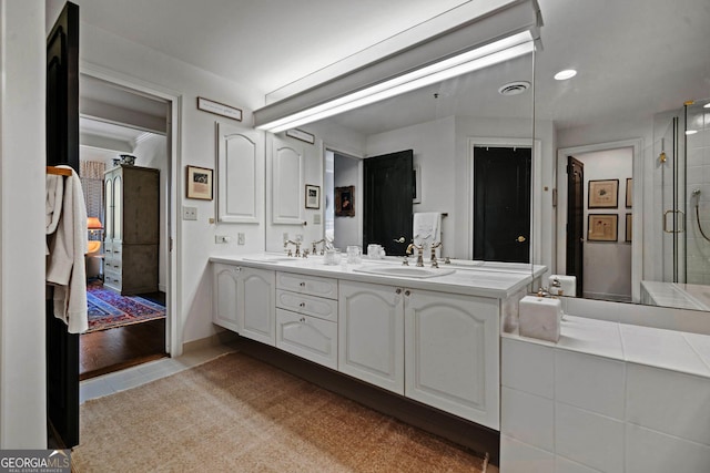2660 Peachtree Rd Unit 6A, Atlanta, GA 30305 - bathroom with double vanity, tile patterned flooring, and a shower with door