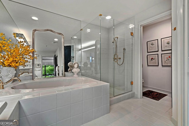 2660 Peachtree Rd Unit 6A, Atlanta, GA 30305 - full bathroom with tile patterned floors, a garden tub, a shower stall, and recessed lighting