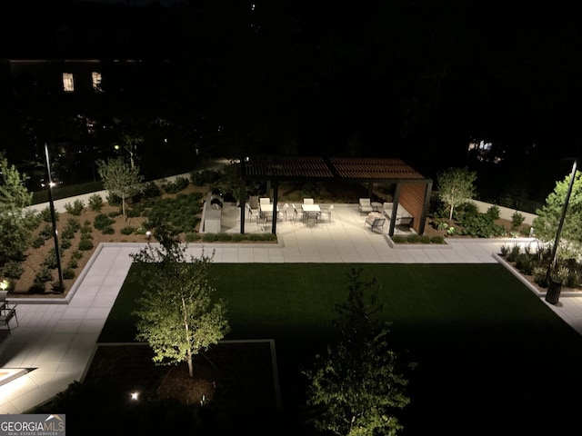 2660 Peachtree Rd Unit 6A, Atlanta, GA 30305 - yard at night featuring a patio and a pergola