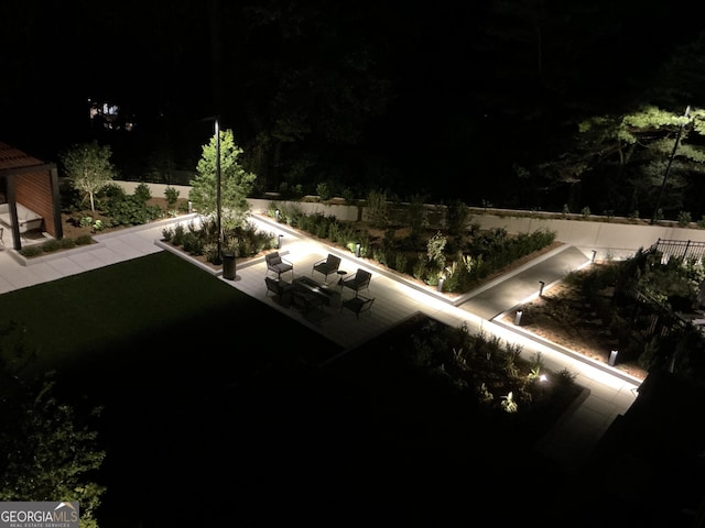 2660 Peachtree Rd Unit 6A, Atlanta, GA 30305 - yard at twilight with a patio area