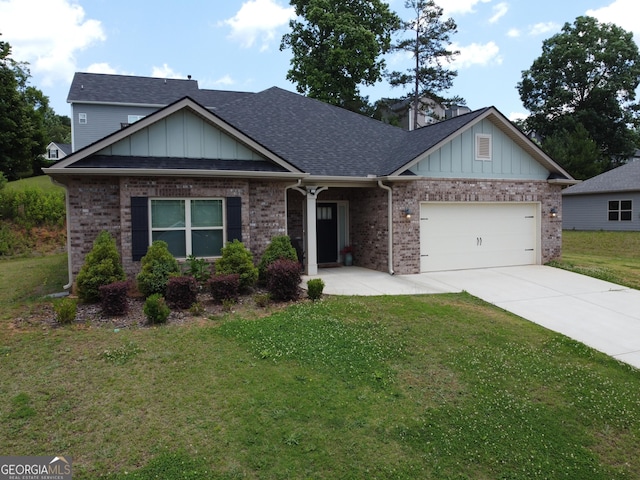 2289 Remington Dr, Commerce, GA 30529 - view of front of property with driveway, a garage, a front lawn, brick siding, and board and batten siding