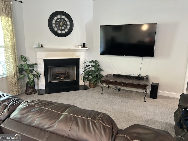 2289 Remington Dr, Commerce, GA 30529 - living area featuring carpet flooring, baseboards, and a fireplace with raised hearth