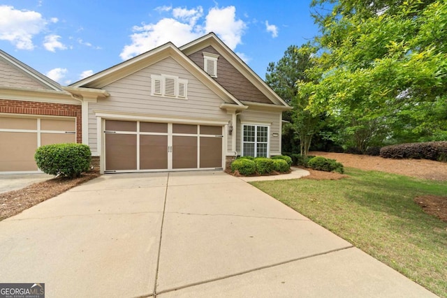 1370 Summer Hollow Rd, Greensboro, GA 30642 - view of front of house with driveway, a front yard, brick siding, and an attached garage