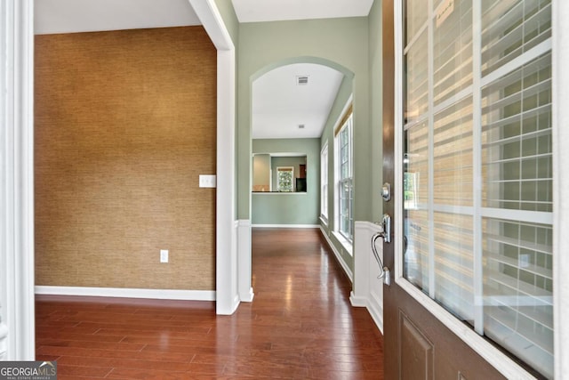 1370 Summer Hollow Rd, Greensboro, GA 30642 - entryway with dark wood-style floors, arched walkways, baseboards, and wallpapered walls