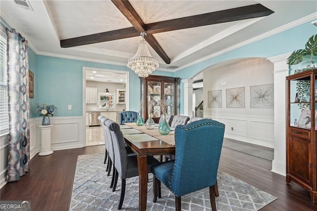 1017 Preserve Park Dr, Loganville, GA 30052 - dining area with coffered ceiling, arched walkways, a decorative wall, beamed ceiling, and dark wood-style floors