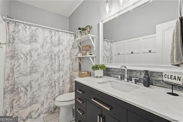 1017 Preserve Park Dr, Loganville, GA 30052 - full bathroom with vanity, marble look tiles, and curtained shower