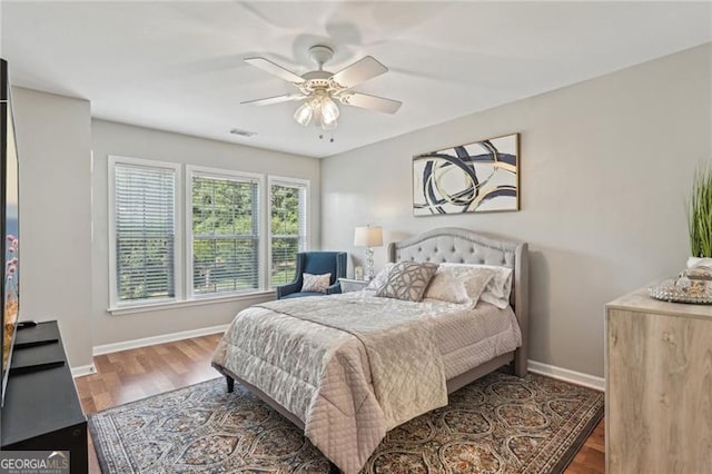 1017 Preserve Park Dr, Loganville, GA 30052 - bedroom with wood finished floors and a ceiling fan