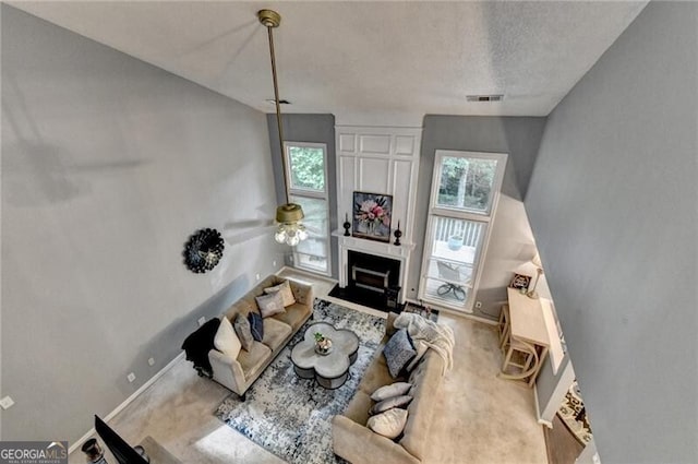 10000 Barston Ct, Johns Creek, GA 30022 - living area with ceiling fan, a fireplace, a textured ceiling, and carpet floors