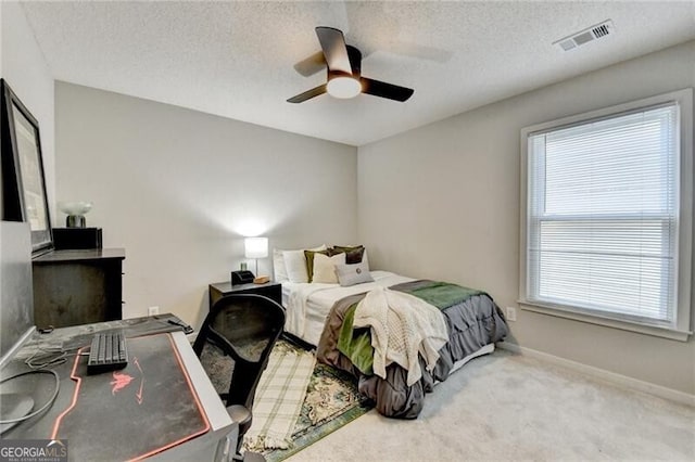 10000 Barston Ct, Johns Creek, GA 30022 - bedroom with multiple windows, carpet flooring, a ceiling fan, and a textured ceiling