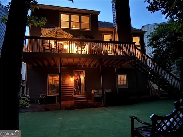 10000 Barston Ct, Johns Creek, GA 30022 - rear view of house featuring stairs, a chimney, a lawn, and a deck