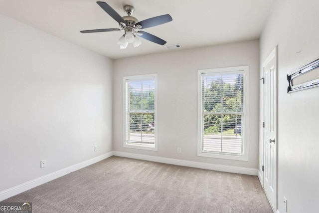 345 Alderwood Ln, Sandy Springs, GA 30328 - spare room with light carpet, healthy amount of natural light, and ceiling fan