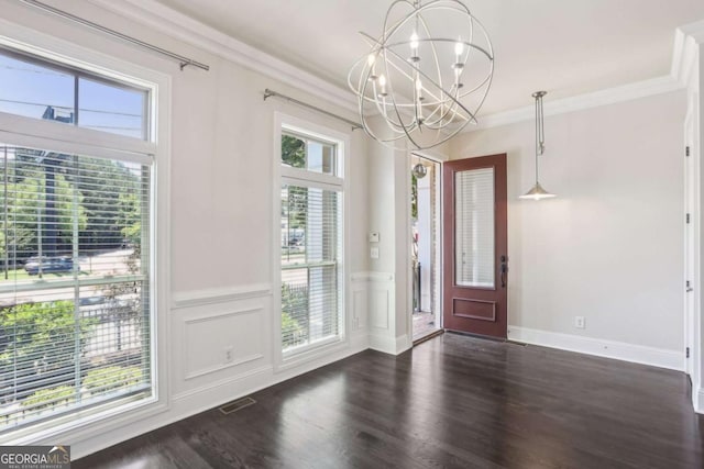 345 Alderwood Ln, Sandy Springs, GA 30328 - foyer entrance featuring a chandelier, ornamental molding, a wainscoted wall, and wood finished floors