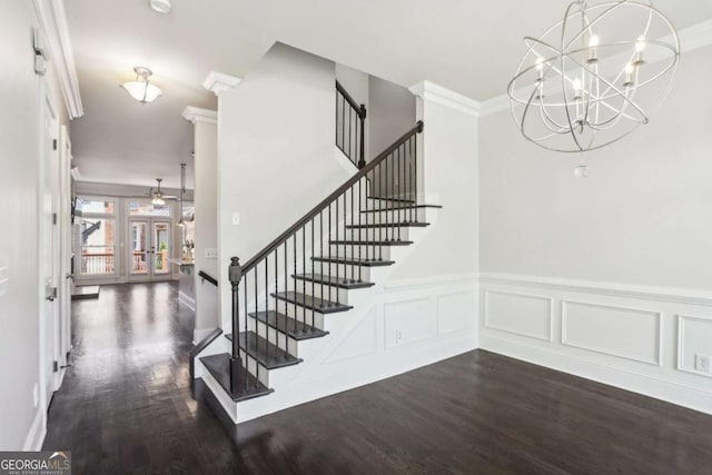 345 Alderwood Ln, Sandy Springs, GA 30328 - stairs featuring wood finished floors, ornamental molding, a chandelier, french doors, and wainscoting