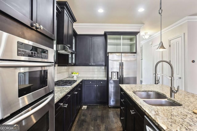 345 Alderwood Ln, Sandy Springs, GA 30328 - kitchen with appliances with stainless steel finishes, dark wood finished floors, ornamental molding, tasteful backsplash, and decorative light fixtures