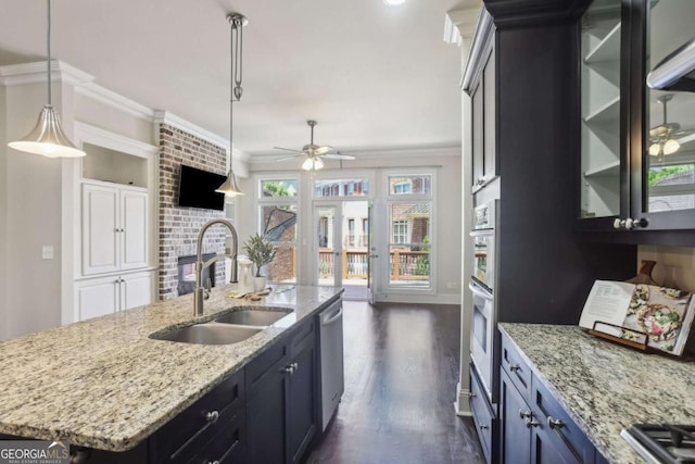 345 Alderwood Ln, Sandy Springs, GA 30328 - kitchen with ornamental molding, ceiling fan, dark wood-style flooring, appliances with stainless steel finishes, and decorative light fixtures