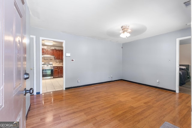 117 Sarsen Cir, Athens, GA 30606 - spare room featuring ceiling fan, light wood-type flooring, and baseboards