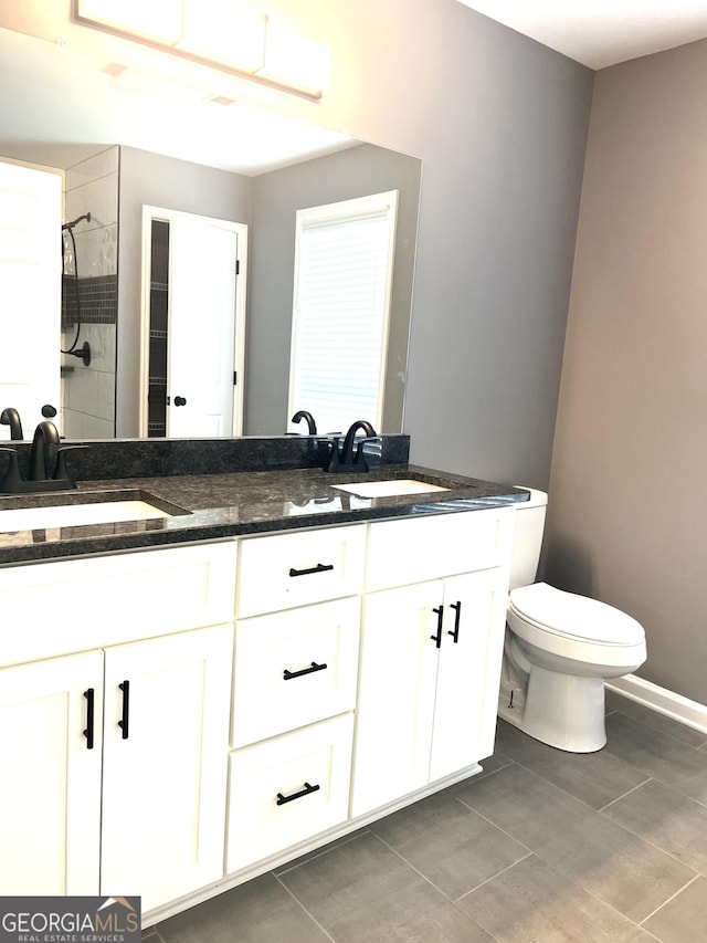 1905 Ridgefield Way, Dalton, GA 30720 - full bathroom featuring double vanity, toilet, tiled shower, and tile patterned floors